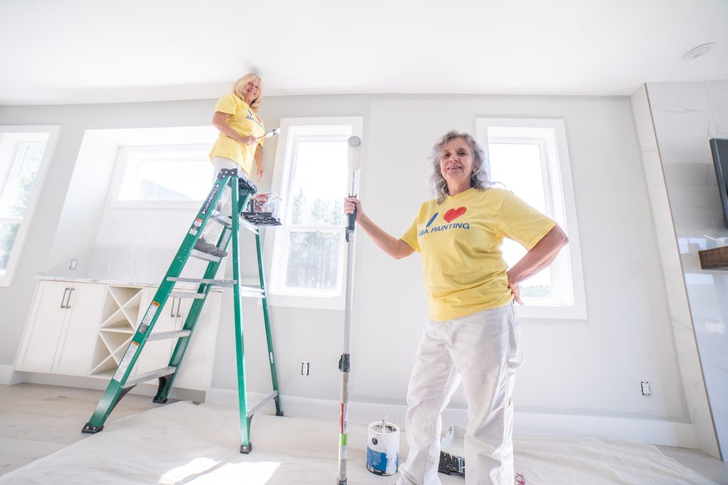 Painting contractor in Nelson BC preparing an exterior surface before painting