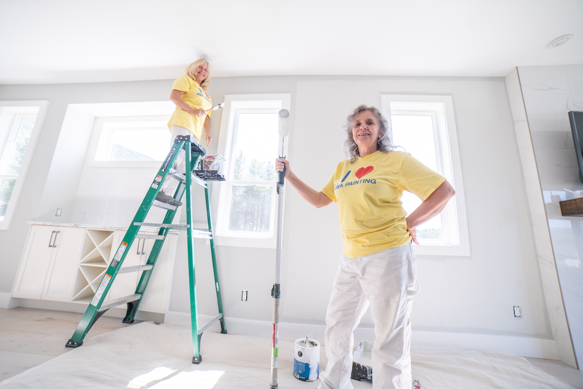 Painting contractor in Nelson BC preparing an exterior surface before painting